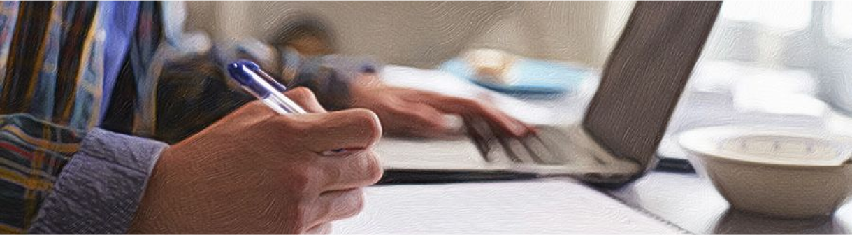 Virtual learning, boy on laptop writing notes