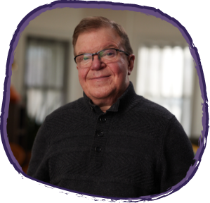 Jason, living with Hunter syndrome smiling at the camera