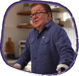 Jason, living with Hunter syndrome, looking to the side